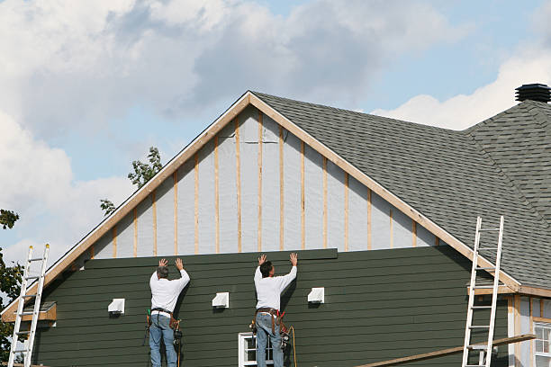 Professional Siding technician working in Houston, TX